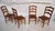 Set of Four Wooden Dining Chairs With Rush Seats These chairs have a simple design, with a ladder back and simple...