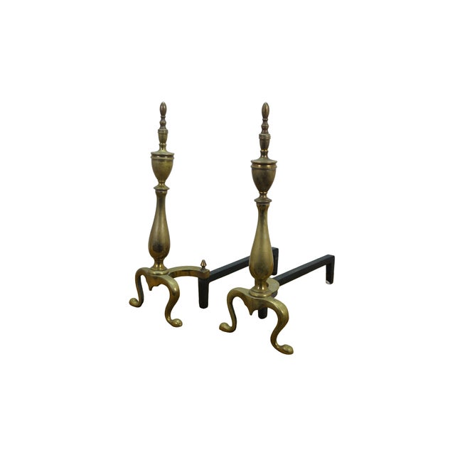Antique brass and cast iron fireplace hearthware andirons firedogs featuring Colonial styling with trophy urn form....