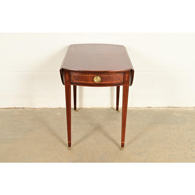 A gorgeous Georgian or Regency style Pembroke nightstand, tea table, or side table By Baker Furniture, "Historic...
