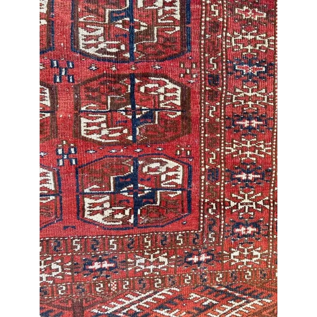 Beautiful little Afghan Boukhara rug with a tribal Boukhara design and red, blue and brown colors, entirely hand knotted...