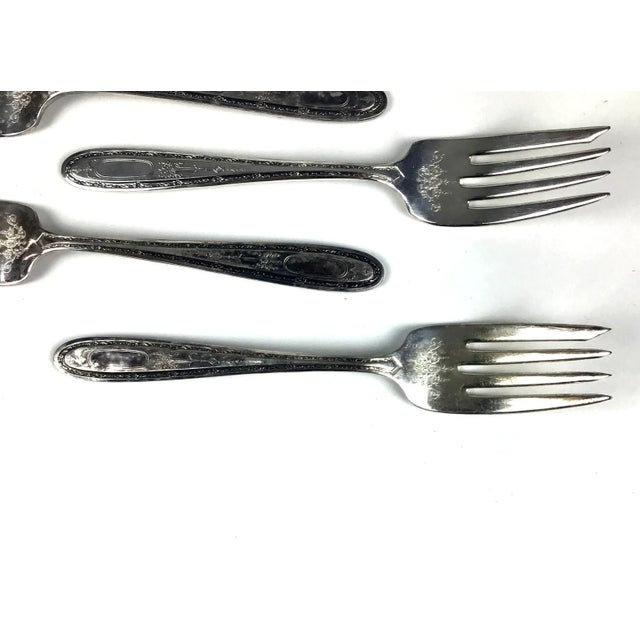 A very detailed set of 6 forks, for salad or fish. We love the details on the front and back and have not polished this...