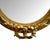 A large mirror in a striking, richly decorated gilded frame, reminiscent of Neo-Rococo styles. Its imposing proportions...