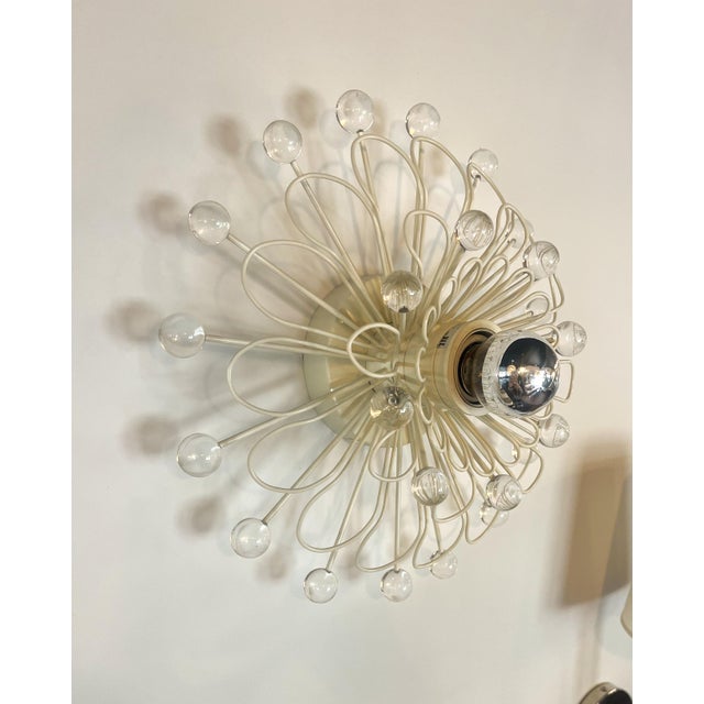 This stunning wall sconce by Kate Spade works perfectly as both a sconce as well as a flush mount. This piece was released...