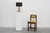 An elegant and architecturally refined table lamp designed and manufactured by Deknudt in Belgium during the 1970s....