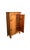 Antique 19th-century fir cabinet featuring two decorated doors that enhance the front with a simple yet elegant touch....