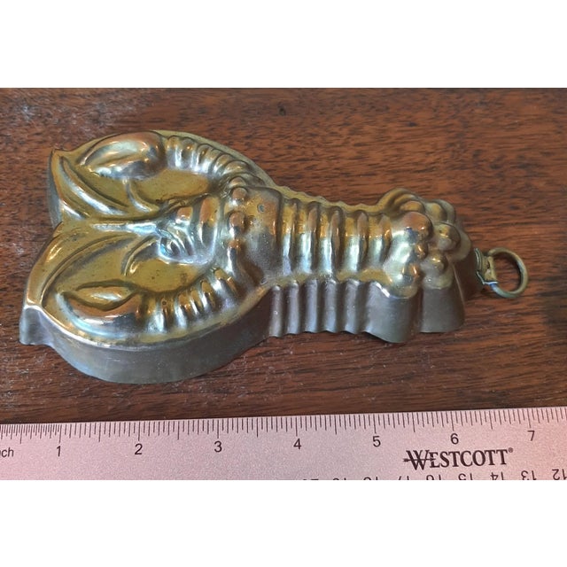Early 1900s copper lobster mold with a tin lining on the inside. It is in great condition and is not a reproduction. This...