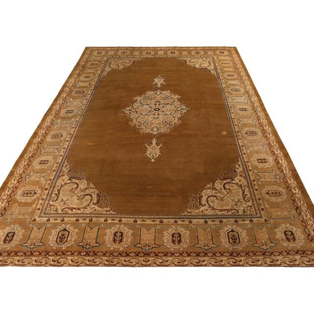 Hand knotted in wool circa 1920-1930, this antique 11x17 Amritsar rug is a particularly rare unveiling from Rug & Kilim....