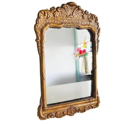 Antique Art Nouveau gold wooden mirror by L.F. Reeker, produced between 1924 and 1927. This mirror was made in the...