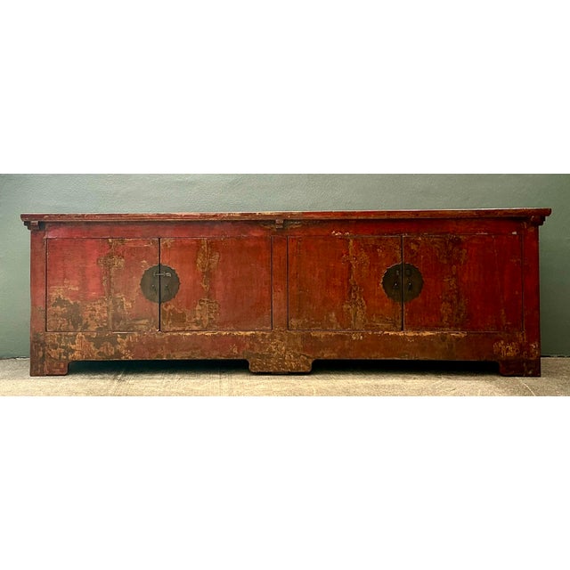 This monumental reclaimed wood credenza is a breathtaking example of Asian-inspired craftsmanship and weathered elegance....
