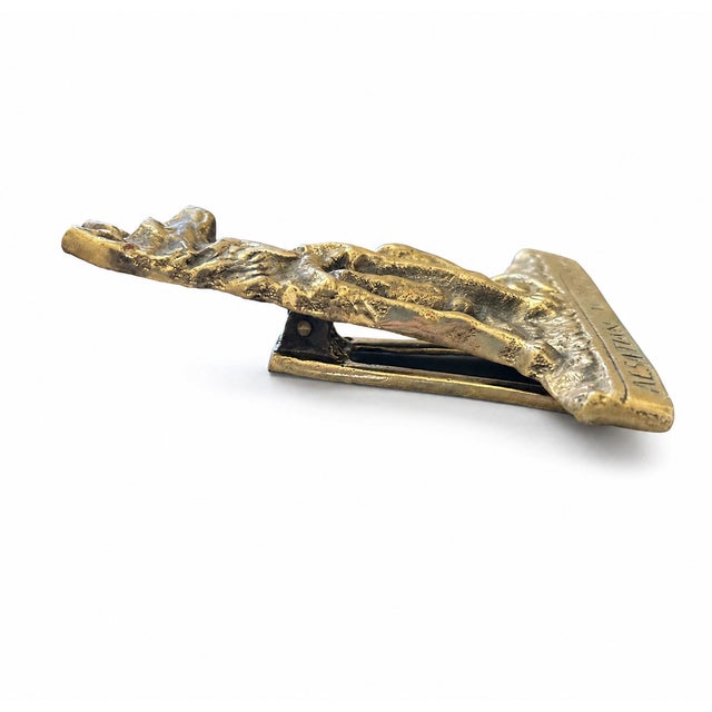 A distinctive vintage brass door knocker featuring a finely detailed Alsatian Wolf Dog, also known as a German Shepherd,...