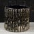 This original vintage vase stands out as a prime example of the eclectic design of 20th-century art ceramics, combining a...