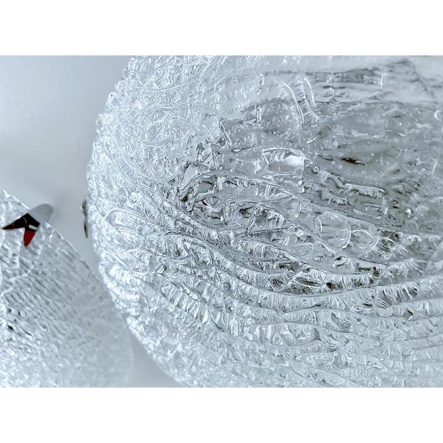Large vintage Murano glass flush mount light with a structured glass mounted on a silver enameled base and chromed claws....