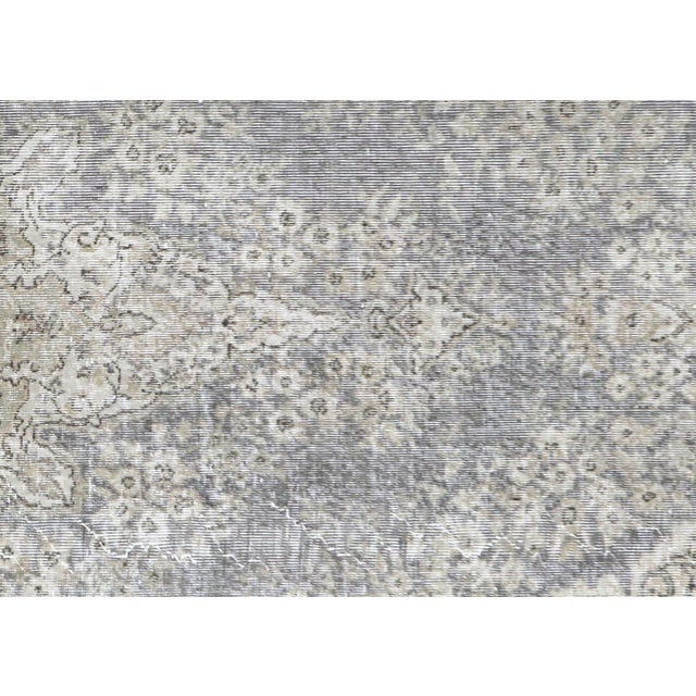 This Vintage Turkish Oushak Rug is hand woven with wool on a wool foundation in the Oushak region of Western Turkey,...