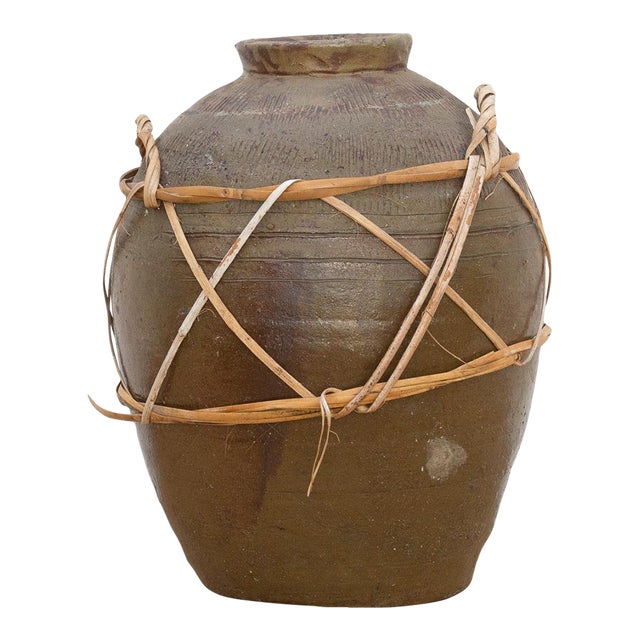 Antique Asian Stoneware Pot With Rattan Harness For Sale