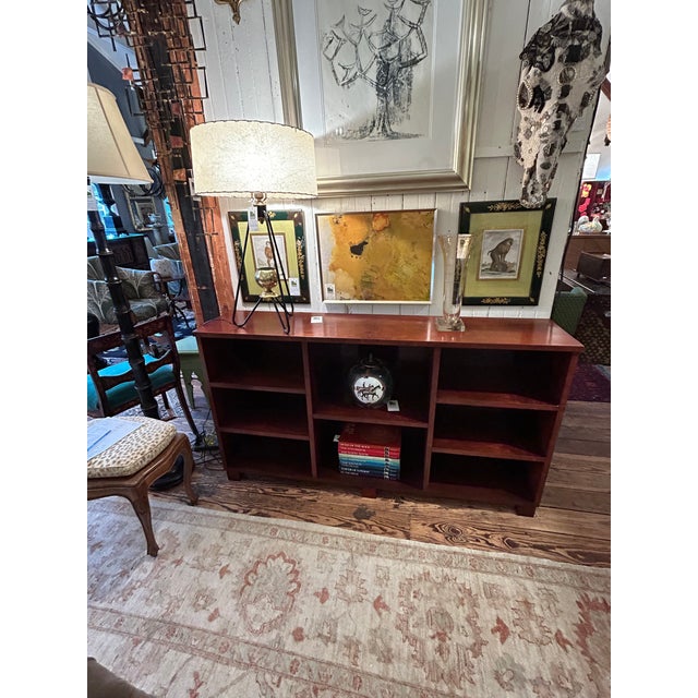 Handsome walnut mid century modern horizontal console and bookcase having multiple sections for books and display/...