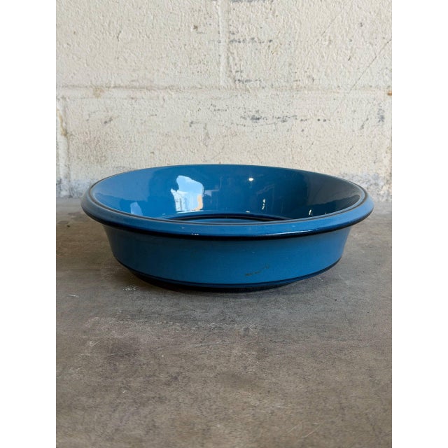 This vintage ceramic salad bowl catches the eye with a clean circular form and straight sides. The minimalist Scandinavian...