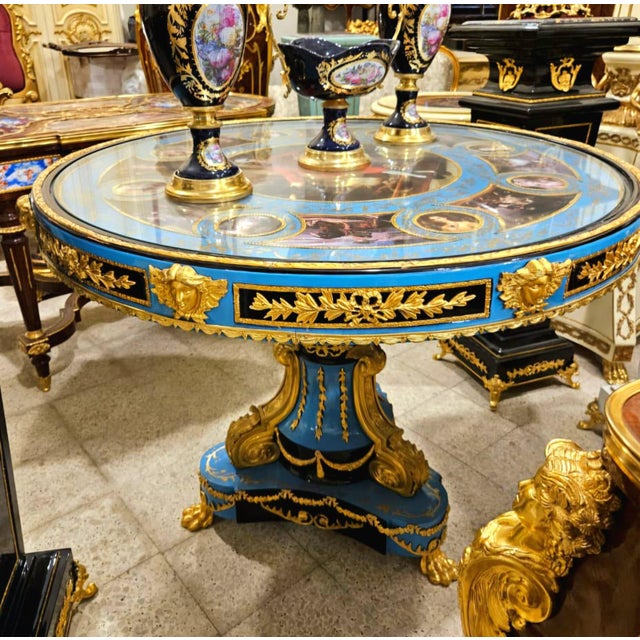 Bring timeless European luxury into your home with this Grand French Empire Round Dining Table, beautifully finished in an...