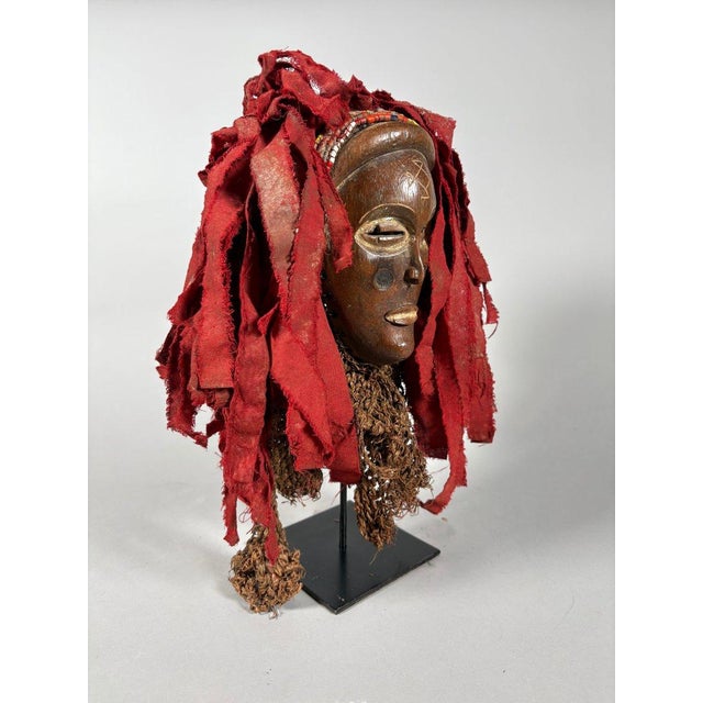 Mwana Pwo Tshokwe Mask , Democratic Republic of Congo. African Art. Carved wooden mask with traces of white pigment,...