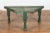 Rustic Indian green painted coffee table crafted from a repurposed bullock cart from the 19th century with curved iron...