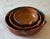 Set of 3 vintage Mexican terra cotta redware nesting bowls with hand painted edges and single handles, handcrafted in...