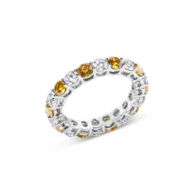 Indulge in the symphony of light and luxury with this exquisite eternity band, elegantly crafted from 14K white gold with...