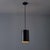 1960s Model 16513 Black Metal Cylindrical Pendants by Eila and John Meiling for Louis Poulsen Executed in black painted...