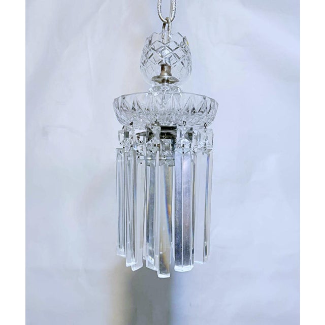 This is a vintage layered chandelier with a cut glass dish and colonial style crystal drops. It features a traditional...