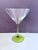 A striking set of six mid-century coupe glasses featuring luminous chartreuse stems and elegant, wide cocktail bowls—an...