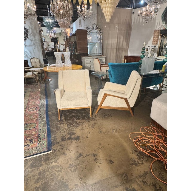 The product is a pair of Italian Gio Ponti MCM arm chairs. The brand, Gio Ponti, is known for its iconic and timeless...
