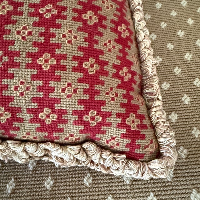 A pair of needlepoint pillows in red, taupe and beige geometric design. Vintage but blends with many styles.