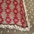 A pair of needlepoint pillows in red, taupe and beige geometric design. Vintage but blends with many styles.