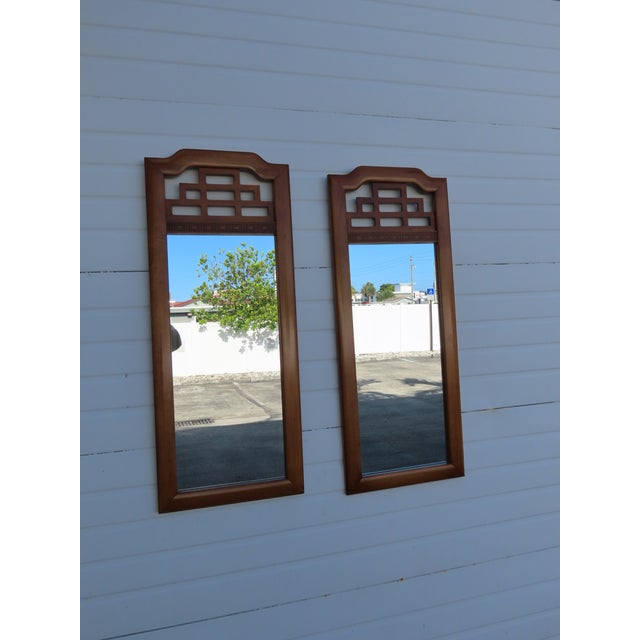 This gorgeous Pair of Mirrors is made out of wood, burlwood, veneer, and mirror. The Mirrors were made by Henry Link, they...