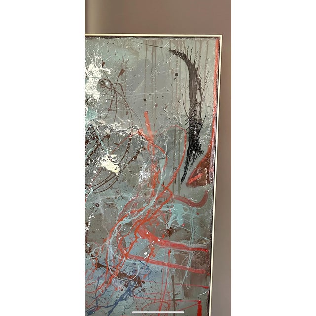 This large slate blue splatter abstract is a dynamic and expressive work of art that immediately catches the eye. The use...
