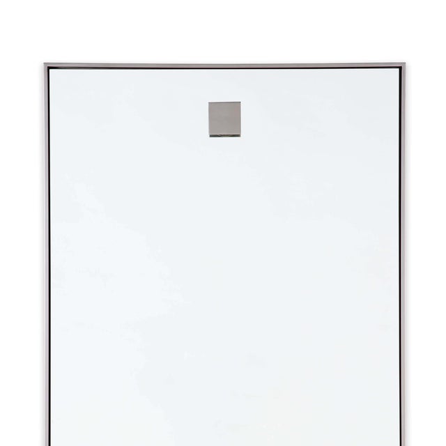 A contemporary mirror with simple details provides versatility for interior styles from modern farmhouse to minimalist.