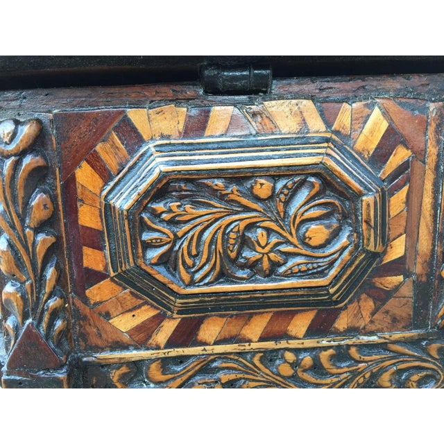 A very large, rare Northern Italian baroque chest circa 1700; with multi-paneled sides and fruitwood marquetry. Inlay of...