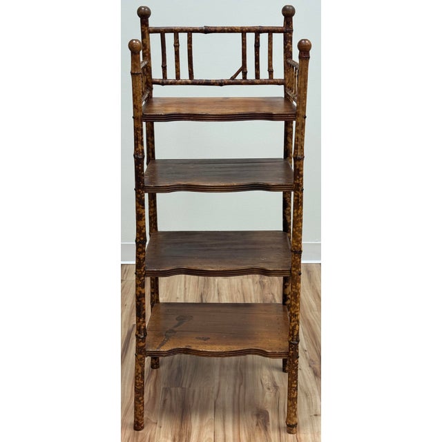 Classic vintage four (4) tier shelf crafted from bamboo featuring a rich scorched finish. Capped with four round knob...