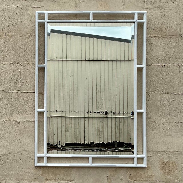 This vintage coastal mirror features a beautifully carved bamboo frame, evoking a relaxed, seaside vibe. With its natural...