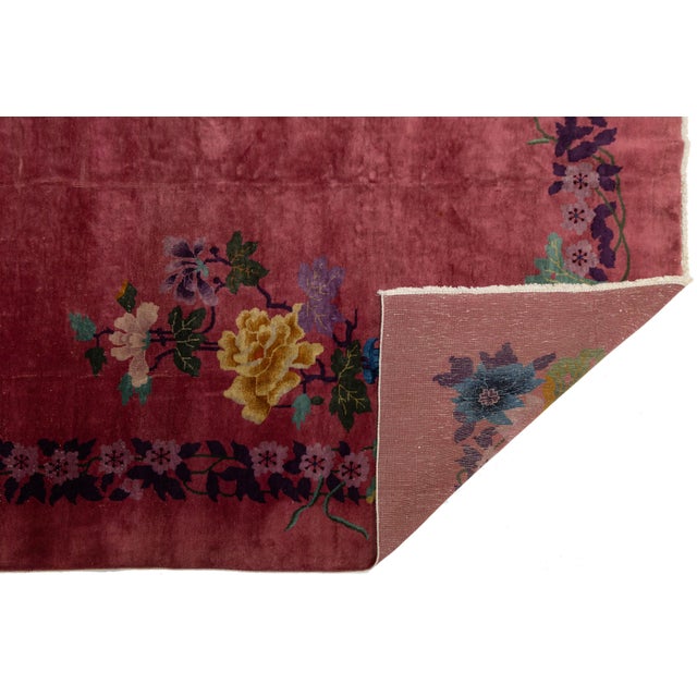 This is an antique Chinese Art Deco rug! It's hand-knotted with wool and features a bold red field and striking multicolor...