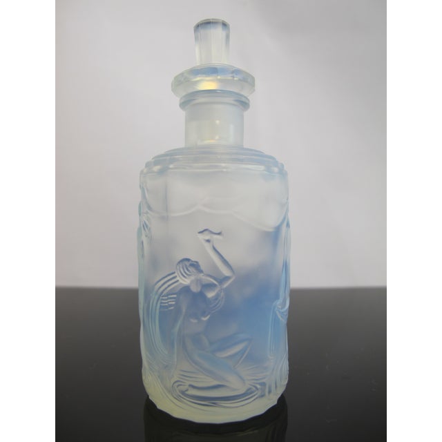 Marius-Ernest Sabino (French, 1878–1961) art deco era glass perfume bottle with stopper. Opalescent glass bottle in tones...