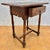 Beautiful Spanish Castilian style side table featuring a single drawer and intricate carved panels, dating from the early...