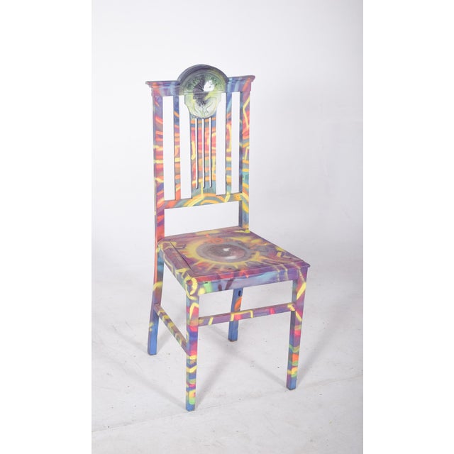 Painted dining chair with eye. With a vertical backrest decorated with a carved medallion, transformed by a contemporary...