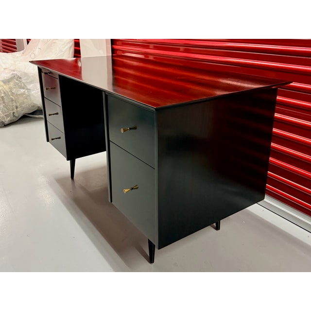 A quintessential masterpiece of American Modernism, this "floating top" executive desk was designed by the legendary Paul...