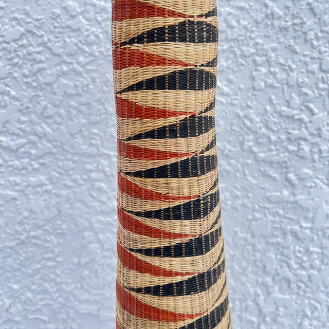 The Tutsi Wedding Basket Vase, originating from Rwanda, stands as a unique masterpiece of Rwandan artistry and cultural...