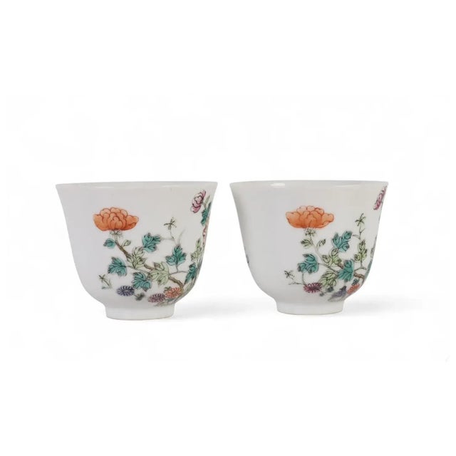 Antique pair Chinese Chien Lung Qianlong porcelain tea cups. Decorated with hand painted chrysanthemum, peony and other...