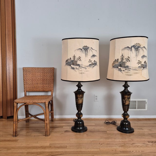 This is a spectacular pair of vintage Japanese etched bronze table lamps of immense stature and visual impact....