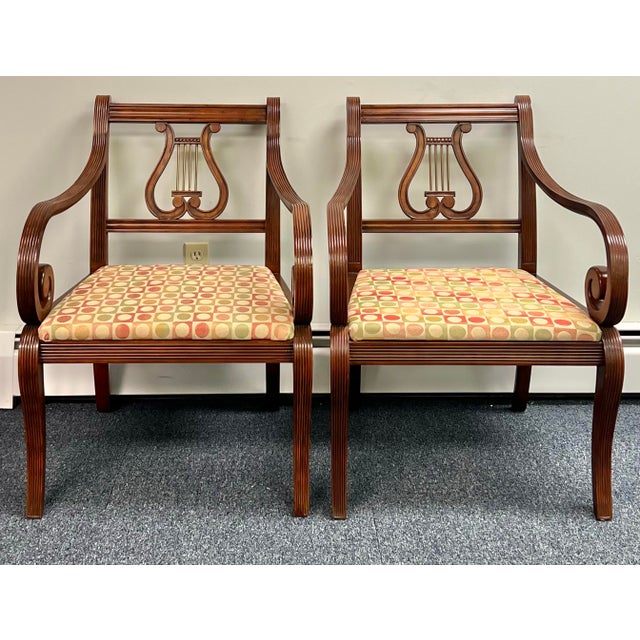 Great pair of lyre back mahogany armchairs. The chairs are made by Thomasville and are a part of their special 100 year...