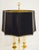 An elegant pair of finely chiseled brass table lamps. In the 20th-century Bouillotte style, they feature a bluish marble-...