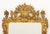 Rococo Style Giltwood Framed Mirror, urn form crest and Greek key details at corners. Mirror plate: 37.25" H x 23.25" W;...