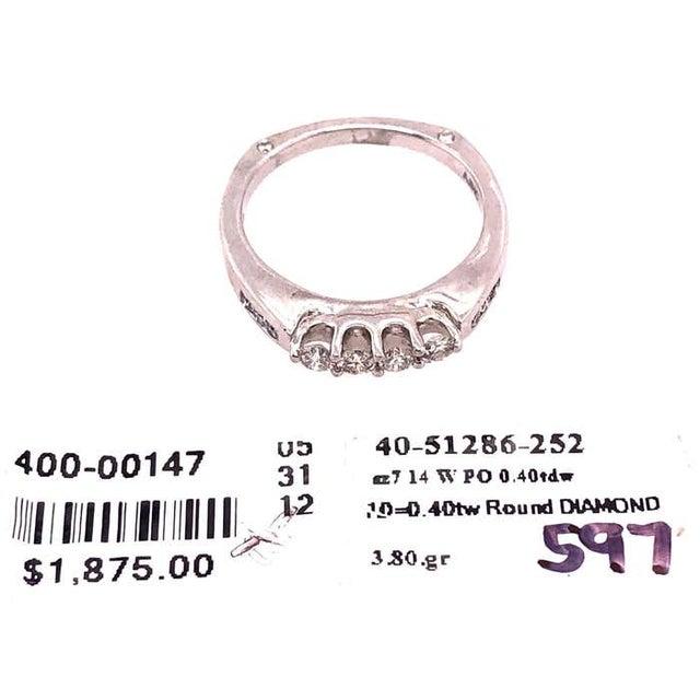 14 Karat White Gold Band Ring with Diamonds 0.40 Total Diamond weight. Size 7 3.80 grams total weight.