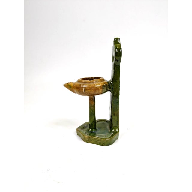 This is an Chinese antique terracotta oil lamp with a San Tsai (3 color glaze). Beautiful as a decorative item and...